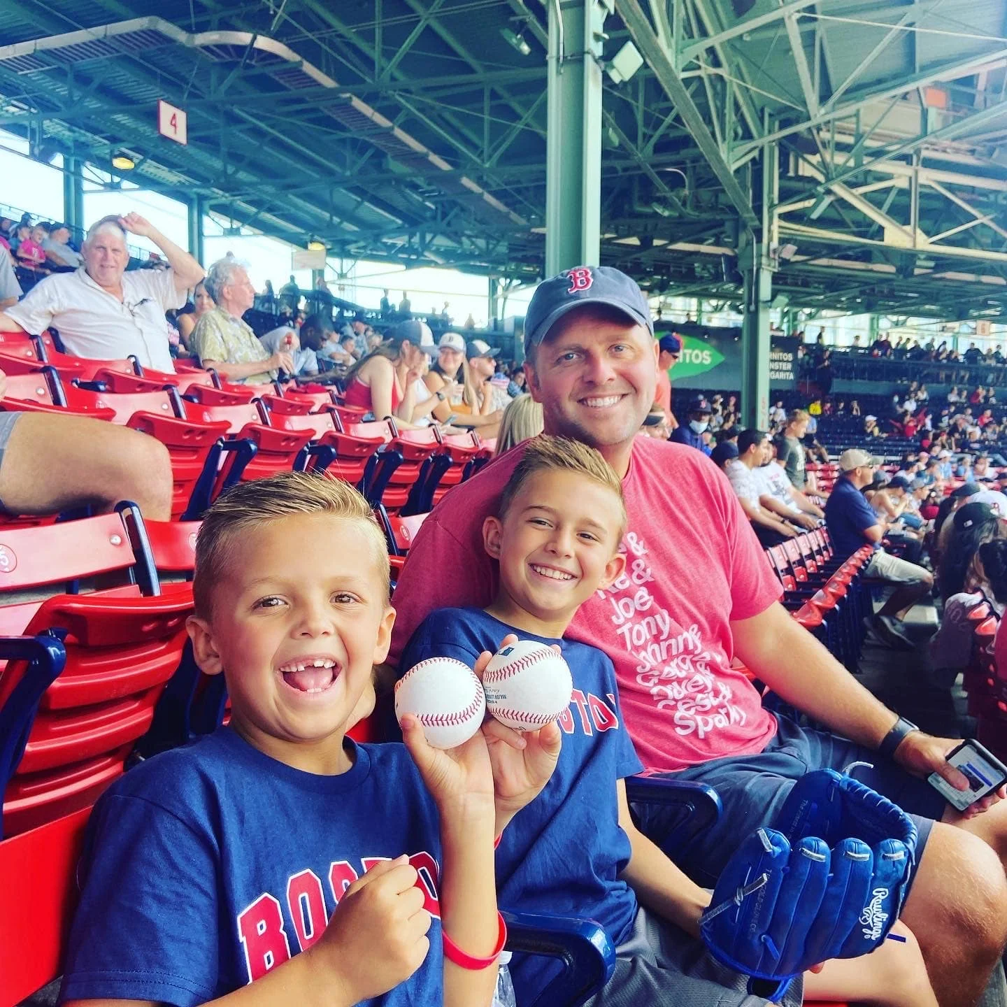 Jake Cain and his kids at a baseball game.
